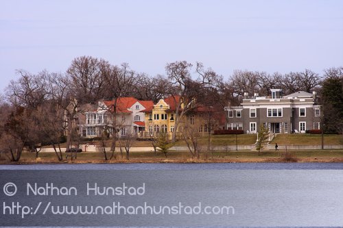 Several stately houses surrounding Lake of the Isles.
